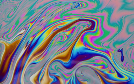 Psychedelic multicolored patterns background. Photo macro shot of soap bubbles