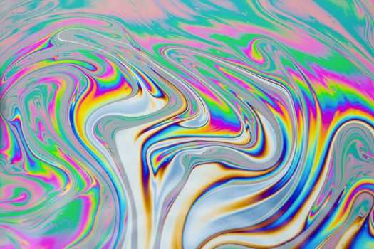 Psychedelic multicolored patterns background. Photo macro shot of soap bubbles