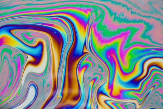 Psychedelic multicolored patterns background. Photo macro shot of soap bubbles