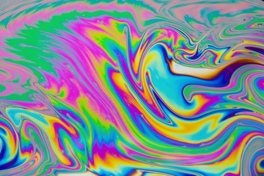 Psychedelic multicolored patterns background. Photo macro shot of soap bubbles