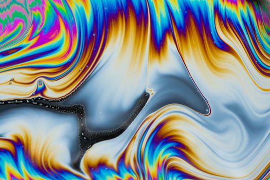 Psychedelic multicolored patterns background. Photo macro shot of soap bubbles