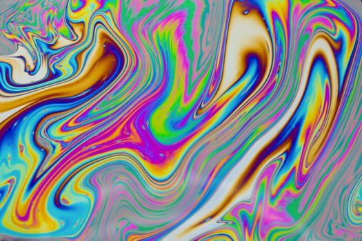 Psychedelic multicolored patterns background. Photo macro shot of soap bubbles