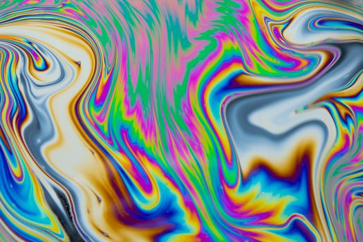 Psychedelic multicolored patterns background. Photo macro shot of soap bubbles