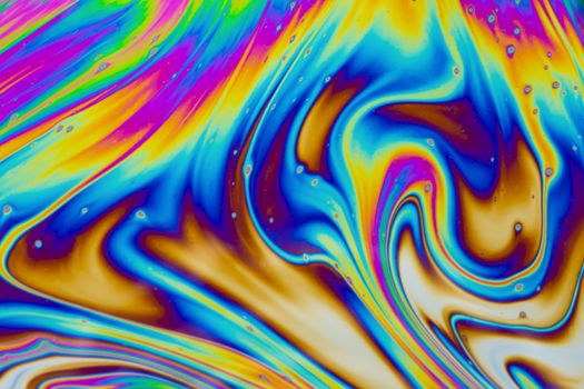 Psychedelic multicolored patterns background. Photo macro shot of soap bubbles