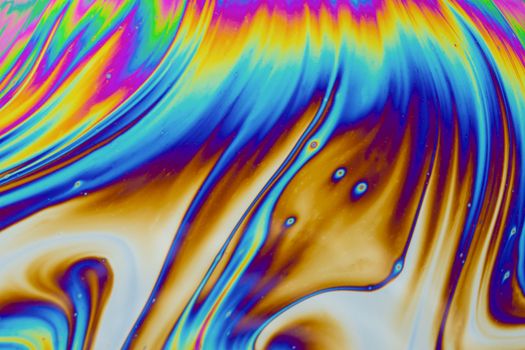 Psychedelic multicolored patterns background. Photo macro shot of soap bubbles