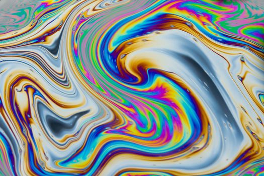 Psychedelic multicolored patterns background. Photo macro shot of soap bubbles