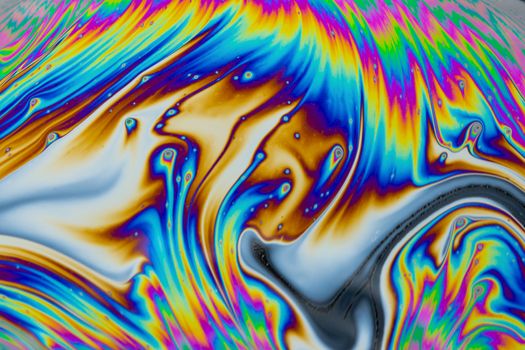 Psychedelic multicolored patterns background. Photo macro shot of soap bubbles