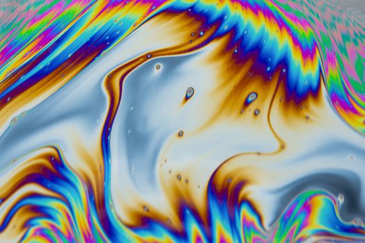 Psychedelic multicolored patterns background. Photo macro shot of soap bubbles