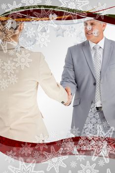 Composite image of Business people having an agreement in a christmas frame