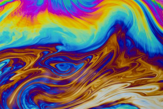 Psychedelic multicolored patterns background. Photo macro shot of soap bubbles