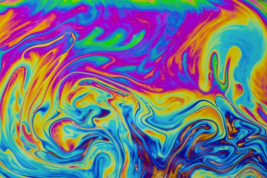 Psychedelic multicolored patterns background. Photo macro shot of soap bubbles
