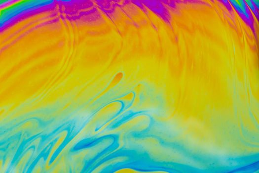 Psychedelic multicolored patterns background. Photo macro shot of soap bubbles