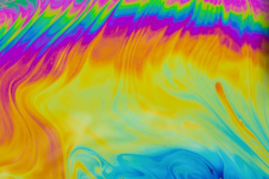 Psychedelic multicolored patterns background. Photo macro shot of soap bubbles
