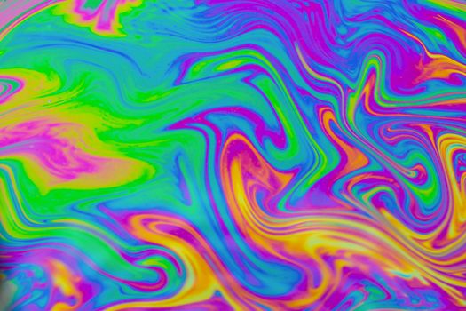 Psychedelic multicolored patterns background. Photo macro shot of soap bubbles