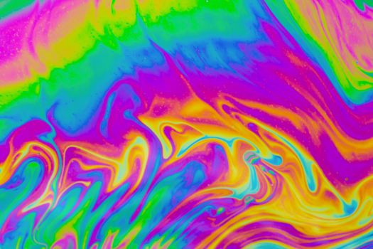 Psychedelic multicolored patterns background. Photo macro shot of soap bubbles