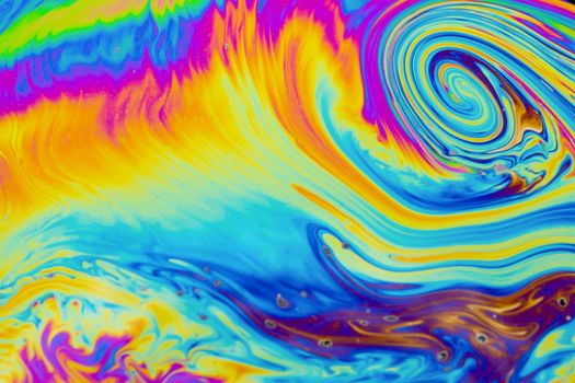 Psychedelic multicolored patterns background. Photo macro shot of soap bubbles