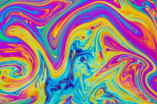 Psychedelic multicolored patterns background. Photo macro shot of soap bubbles