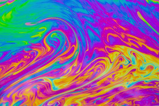 Psychedelic multicolored patterns background. Photo macro shot of soap bubbles