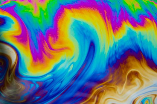 Psychedelic multicolored patterns background. Photo macro shot of soap bubbles