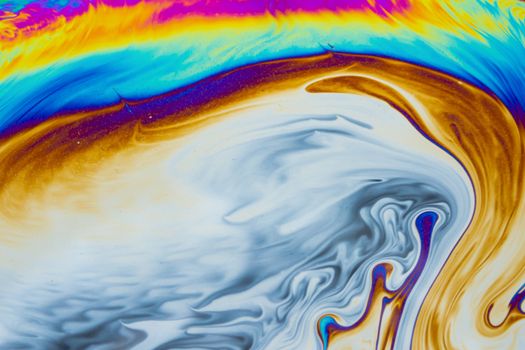 Psychedelic multicolored patterns background. Photo macro shot of soap bubbles