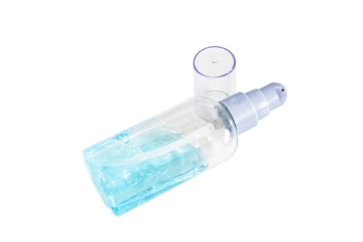 The close up of alcohol gel in small transparent plastic bottle on white background.