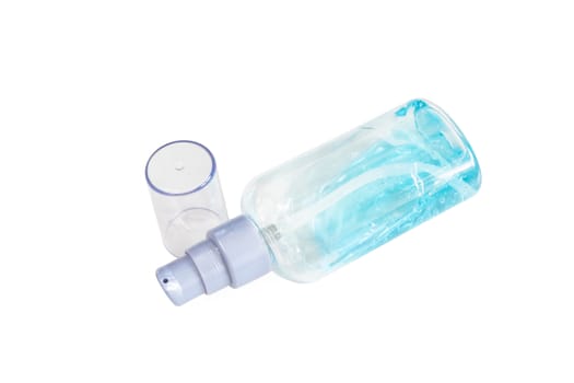 The close up of alcohol gel in small transparent plastic bottle on white background.