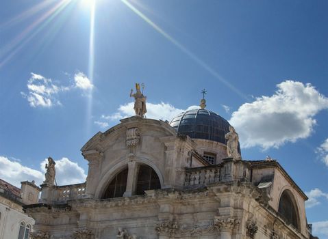 An old ornate church under clear blue skies in Dubrovnik, Croatia