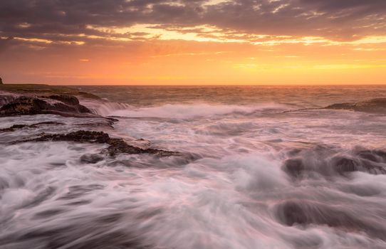 A serene low tide  suddenly changed when whipped up as gale winds arrive just before sunrise