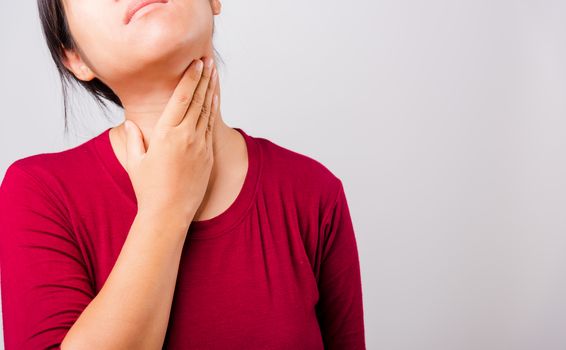 Asian beautiful woman itching her scratching her itchy neck on white background with copy space, Medical and Healthcare concept