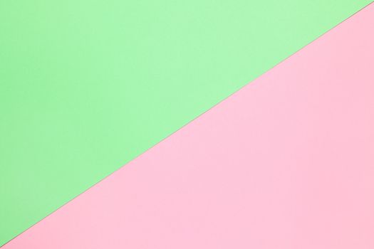 Abstract festive spring flat lay. Pastel two-color paper background pink and green, copy space. March 8, February 14, Birthday, St. Valentine's, Mother's, Women's day celebration concept.