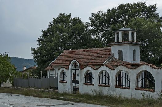 A beautiful landscape with a small old church in the village of Muhovo, Ihtiman region, Bulgaria, Europe