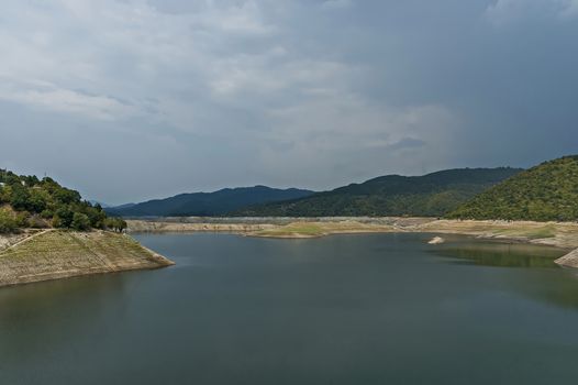 View of the Topolnitsa dam, reservoir, lake or barrage on the river Topolnitsa near village Muhovo, Ihtiman region, Bulgaria, Europe