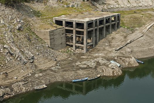 View from Topolnitsa dam, lake or barrage on the river Topolnitsa and old abandoned construction near village Muhovo, Ihtiman region, Bulgaria, Europe