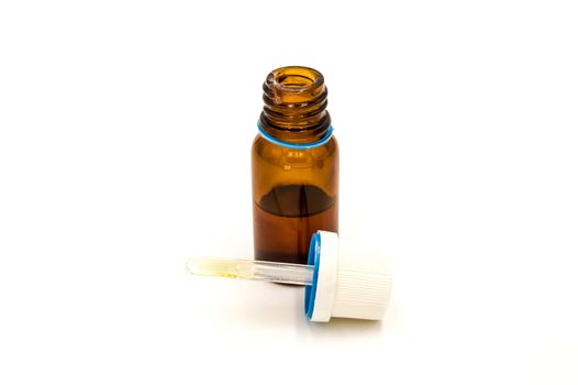 A brown pharmacy bottle with a dropper on a white background