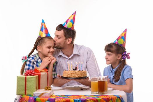 Children wish dad happy birthday, father kisses daughter
