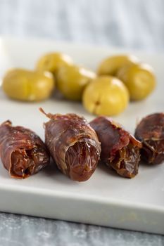 spanish dates with ham on a plate