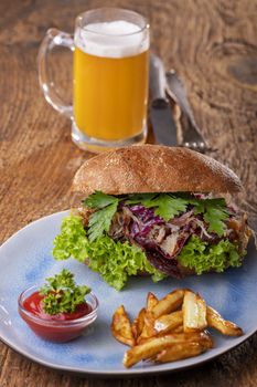 pulled pork in a bun with beer