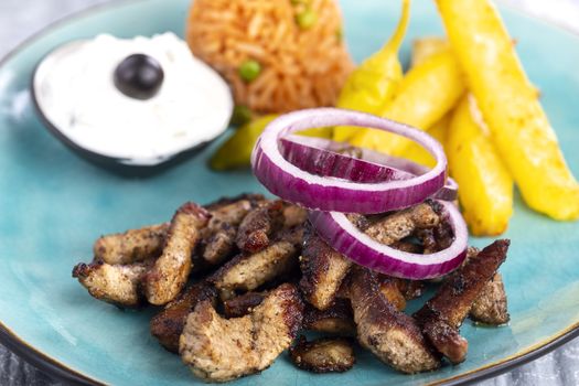 greek gyros on a plate with fries