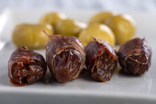 spanish dates with ham on a plate