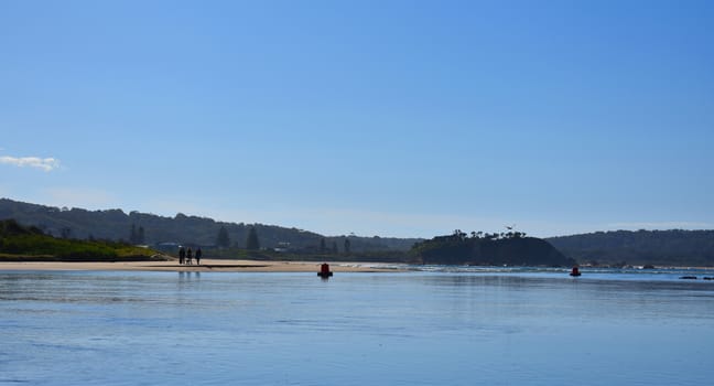 A family walking along the beach