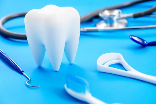 Dental model and dental equipment on blue background, concept image of dental background. dental hygiene background