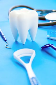 Dental model and dental equipment on blue background, concept image of dental background. dental hygiene background