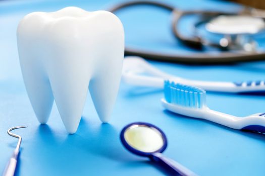 Dental model and dental equipment on blue background, concept image of dental background. dental hygiene background