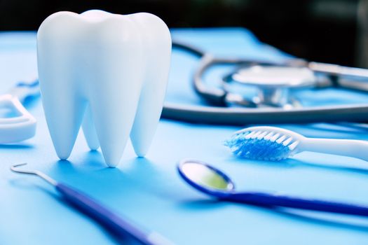 Dental model and dental equipment on blue background, concept image of dental background. dental hygiene background