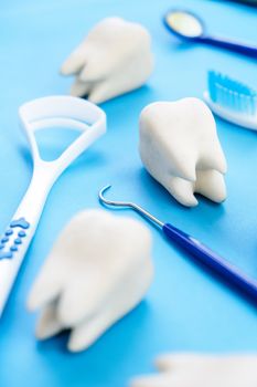 Dental model and dental equipment on blue background, concept image of dental background. dental hygiene background