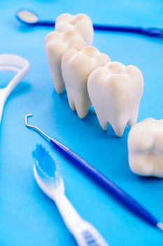 Dental model and dental equipment on blue background, concept image of dental background. dental hygiene background