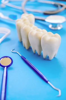 Dental model and dental equipment on blue background, concept image of dental background. dental hygiene background