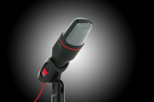 A black and red microphone on dark background