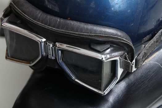 Old biker helmet and goggles. with break pedal