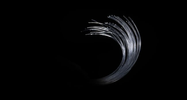 fibered optics glowing wire on black background with copy space and white glow